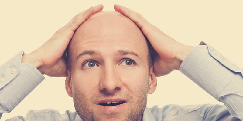 Amazed or surprised bald-headed man